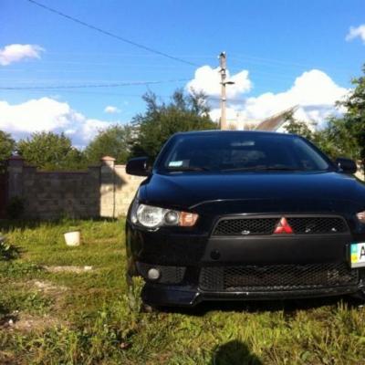 кортеж Mitsubishi Lancer X — логотип